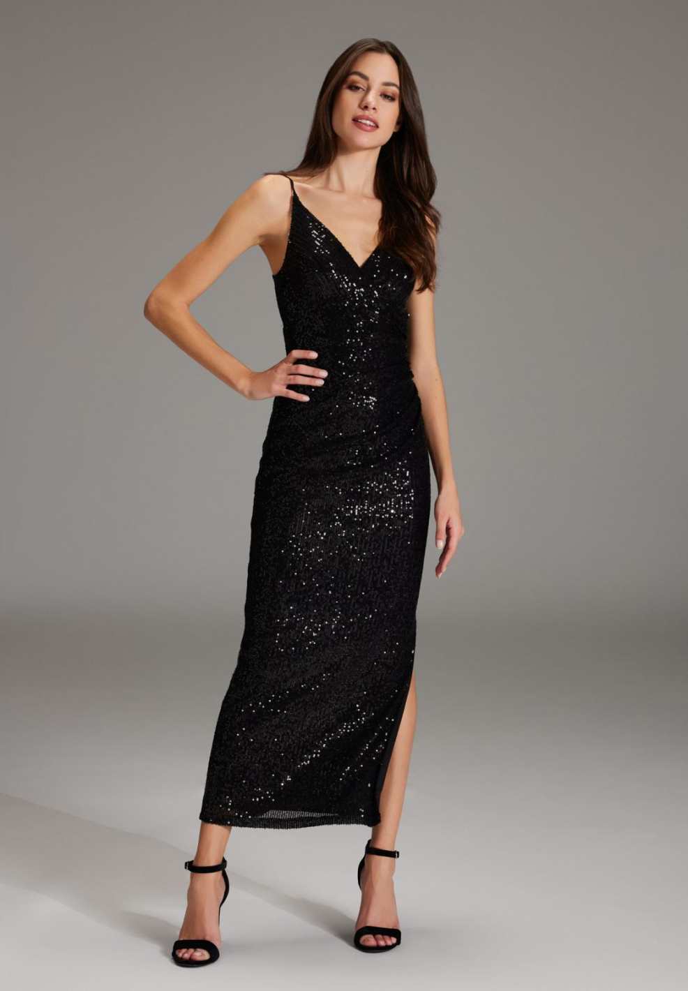 Abendkleid aus elastischer Paillette mit Spagetti Trägern und seitlichem Schlitz