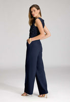 Jumpsuit aus Material-Mix mit Drapierung