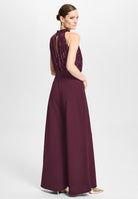 Ärmelloser Jumpsuit mit Schluppenblusen Top aus elastischer Paillette