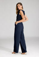 Jumpsuit aus Material-Mix mit Drapierung